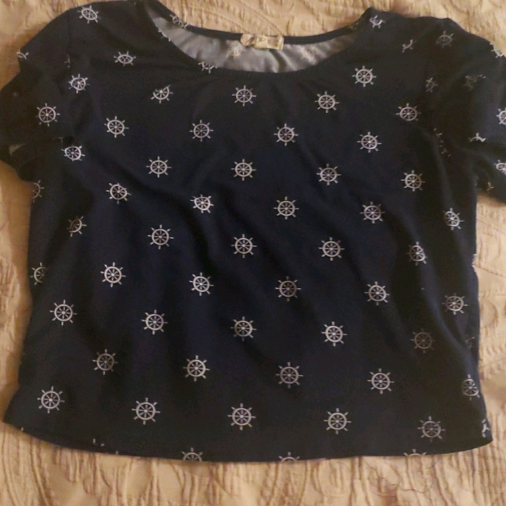 a blue top with sailor wheels